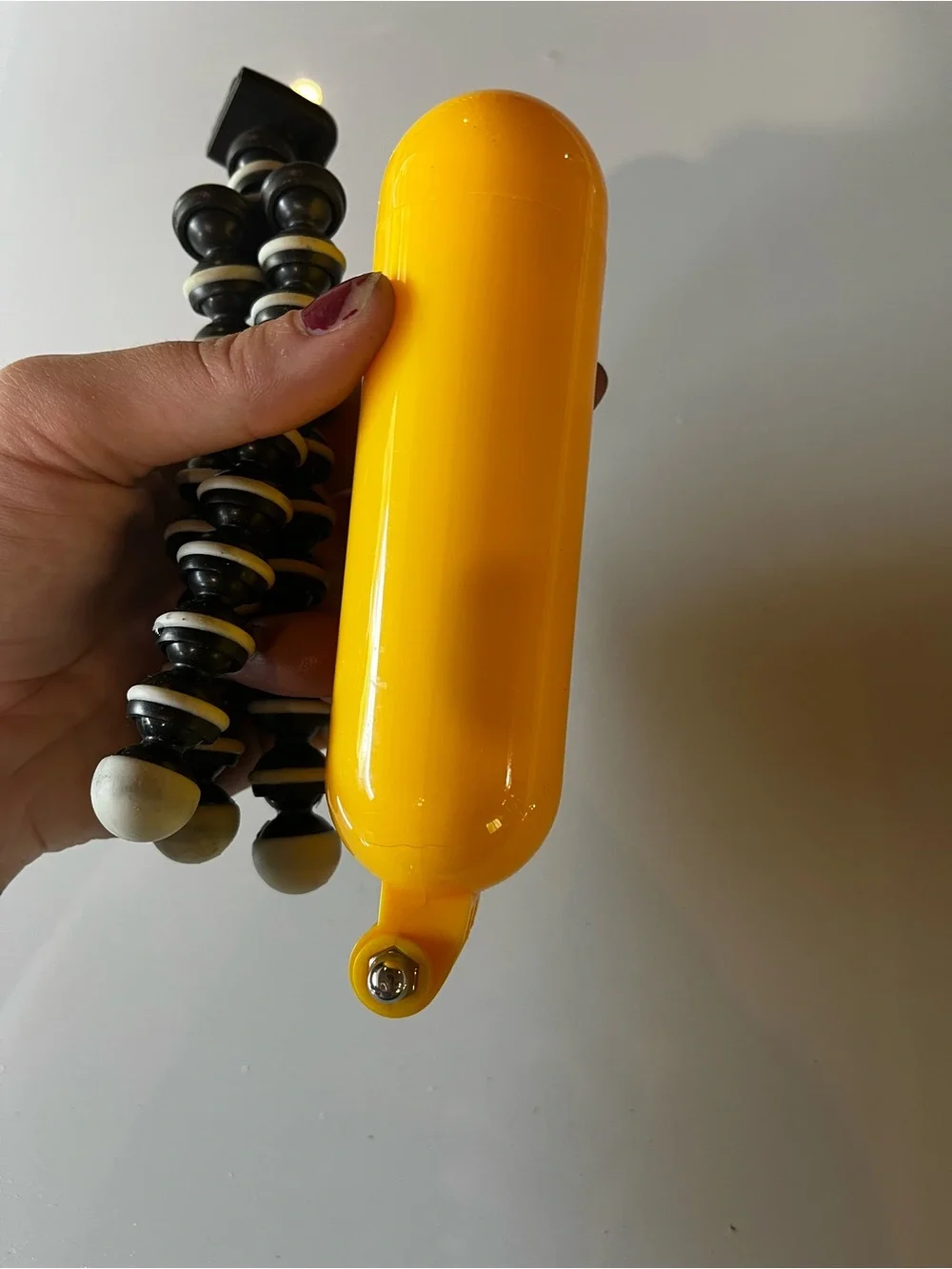 GoPro HERO 3 with Yellow Floating Hand Grip and Black/White Flexible Tripod